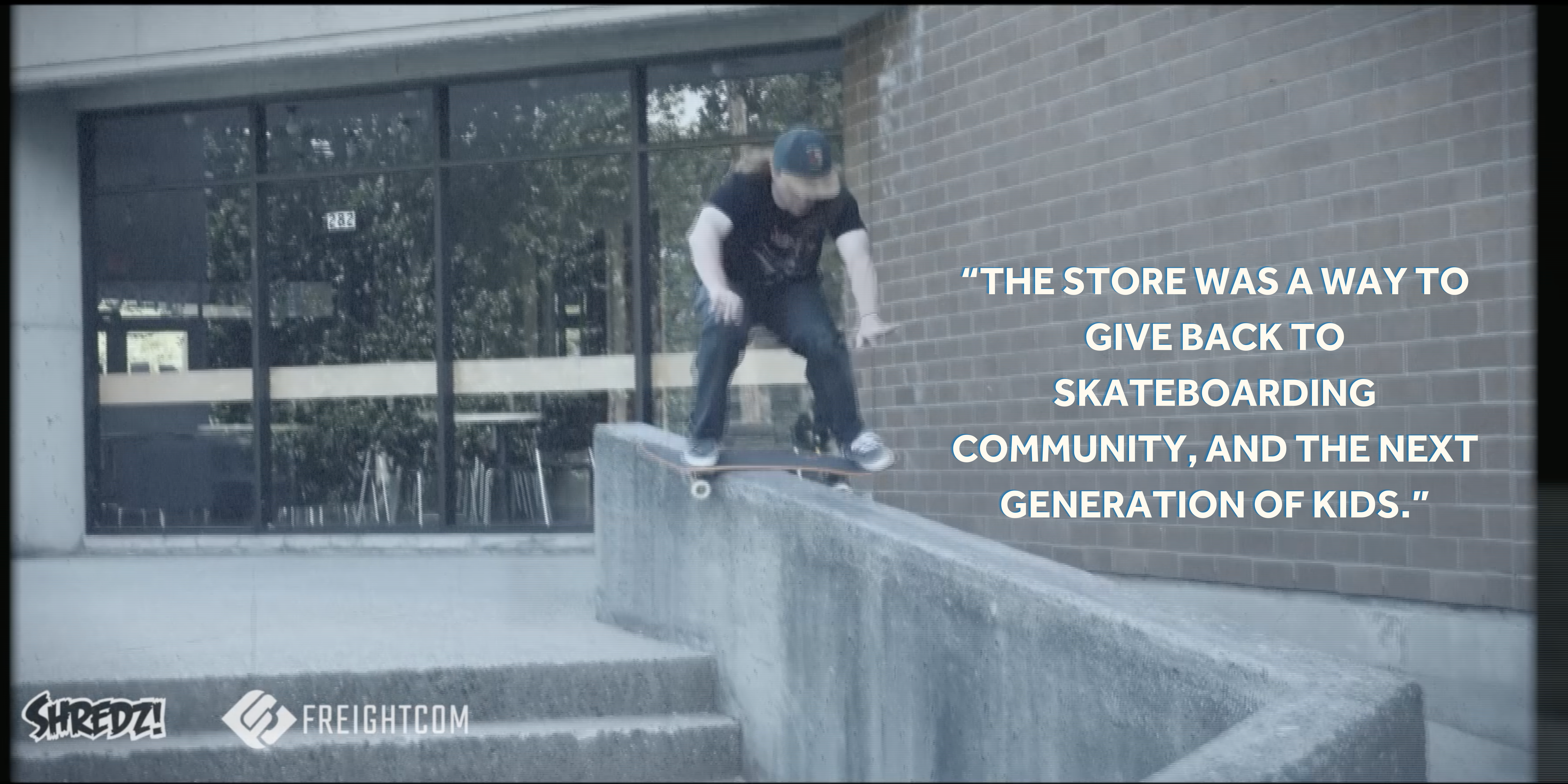 A skateboarder does a boardslide on a narrow ledge down stairs