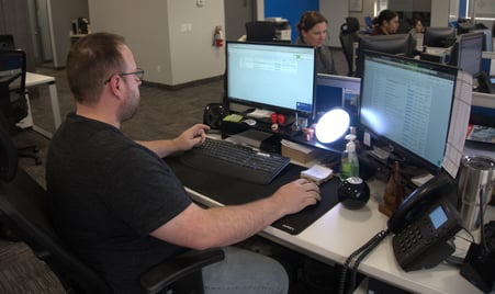 image of customer service team leader at desk - Freightcom staff